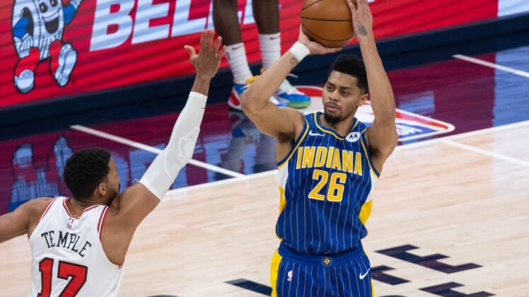Feb 15, 2021; Indianapolis, Indiana, USA; Indiana Pacers guard Jeremy Lamb (26) shoots the ball while Chicago Bulls guard Garrett Temple (17) defends  in the fourth quarter at Bankers Life Fieldhouse. Mandatory Credit: Trevor Ruszkowski-USA TODAY Sports
