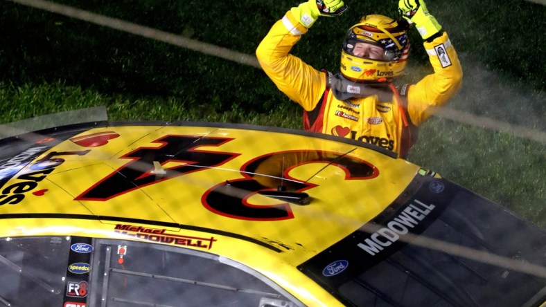 Feb 14, 2021; Daytona Beach, Florida, USA; NASCAR Cup Series driver Michael McDowell (34) celebrates winning the Daytona 500 at Daytona International Speedway. Mandatory Credit: Mark J. Rebilas-USA TODAY Sports