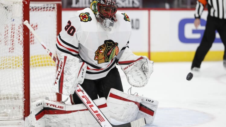 Feb 15, 2021; Detroit, Michigan, USA; Chicago Blackhawks goaltender Malcolm Subban (30) makes a save during the second period against the Detroit Red Wings at Little Caesars Arena. Mandatory Credit: Raj Mehta-USA TODAY Sports