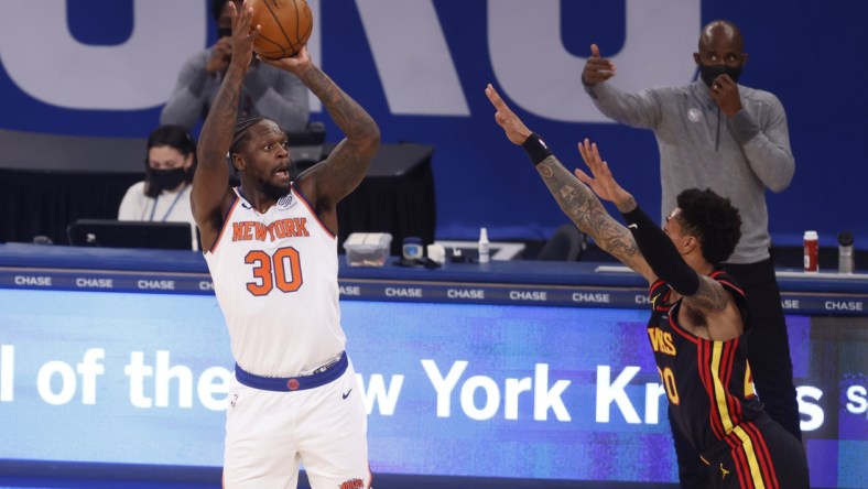 Feb 15, 2021; New York, New York, USA;  New York Knicks' Julius Randle (30) shoots against Atlanta Hawks' John Collins (20) during the first quarter at Madison Square Garden. Mandatory Credit: Jason DeCrow/Pool Photo-USA TODAY Sports