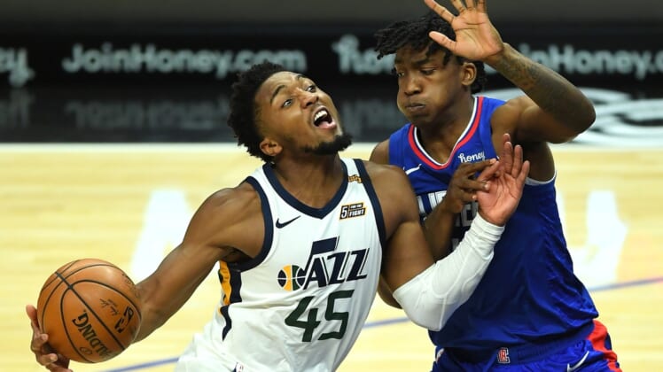 Feb 17, 2021; Los Angeles, California, USA; Utah Jazz guard Donovan Mitchell (45) is defended by Los Angeles Clippers guard Terance Mann (14) as he drives to the basket in the second half of the game at Staples Center. Mandatory Credit: Jayne Kamin-Oncea-USA TODAY Sports