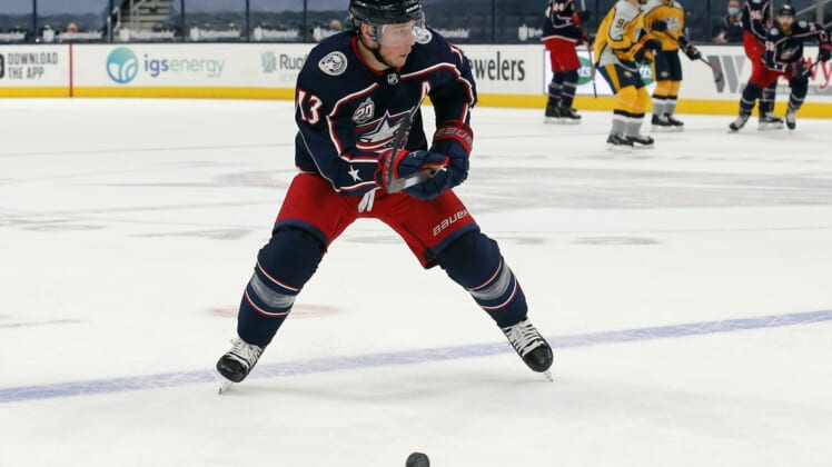 Feb 18, 2021; Columbus, Ohio, USA; Columbus Blue Jackets right wing Cam Atkinson (13) looks to shoot against the Nashville Predators during the first period at Nationwide Arena. Mandatory Credit: Russell LaBounty-USA TODAY Sports