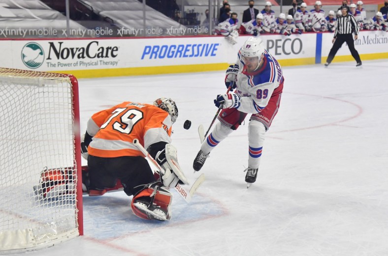 Feb 18, 2021; Philadelphia, Pennsylvania, USA; Philadelphia Flyers goaltender Carter Hart (79) makes a save against New York Rangers right wing Pavel Buchnevich (89) on a penalty shot during the second period at Wells Fargo Center. Mandatory Credit: Eric Hartline-USA TODAY Sports