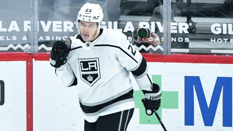 Feb 18, 2021; Glendale, Arizona, USA; Los Angeles Kings right wing Dustin Brown (23) celebrates after scoring a goal against the Arizona Coyotes in the first period at Gila River Arena. Mandatory Credit: Matt Kartozian-USA TODAY Sports