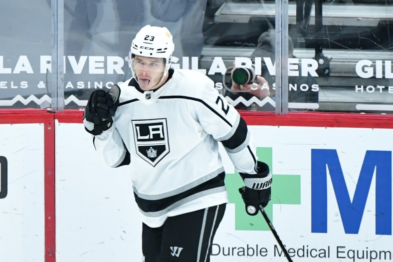 Feb 18, 2021; Glendale, Arizona, USA; Los Angeles Kings right wing Dustin Brown (23) celebrates after scoring a goal against the Arizona Coyotes in the first period at Gila River Arena. Mandatory Credit: Matt Kartozian-USA TODAY Sports