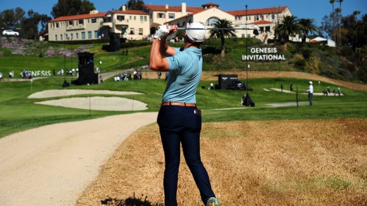 Feb 19, 2021; Pacific Palisades, California, USA; Sam Burns plays his shot on the rough of the ninth hole course during the second round of The Genesis Invitational golf tournament at Riviera Country Club. Mandatory Credit: Gary A. Vasquez-USA TODAY Sports
