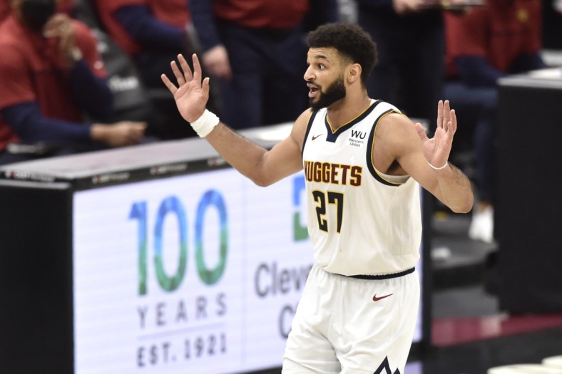 Feb 19, 2021; Cleveland, Ohio, USA; Denver Nuggets guard Jamal Murray (27) reacts after making a basket in the fourth quarter against the Cleveland Cavaliers at Rocket Mortgage FieldHouse. Mandatory Credit: David Richard-USA TODAY Sports