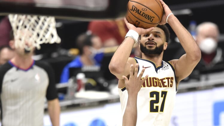 Feb 19, 2021; Cleveland, Ohio, USA; Denver Nuggets guard Jamal Murray (27) makes a basket in the fourth quarter against the Cleveland Cavaliers at Rocket Mortgage FieldHouse. Mandatory Credit: David Richard-USA TODAY Sports