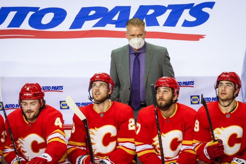 Feb 19, 2021; Calgary, Alberta, CAN; Calgary Flames head coach Geoff Ward on his bench against the Edmonton Oilers during the second period at Scotiabank Saddledome. Mandatory Credit: Sergei Belski-USA TODAY Sports