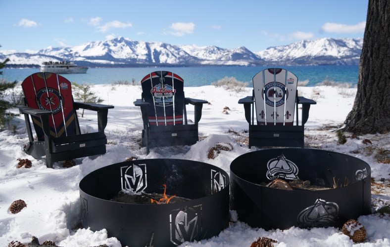 Feb 20, 2021; Stateline, NV, USA; General view of fire pits with the Colorado Avalanche and Vegas Golden Knights logos in the first period of a NHL Outdoors hockey game at Lake Tahoe. Mandatory Credit: Kirby Lee-USA TODAY Sports