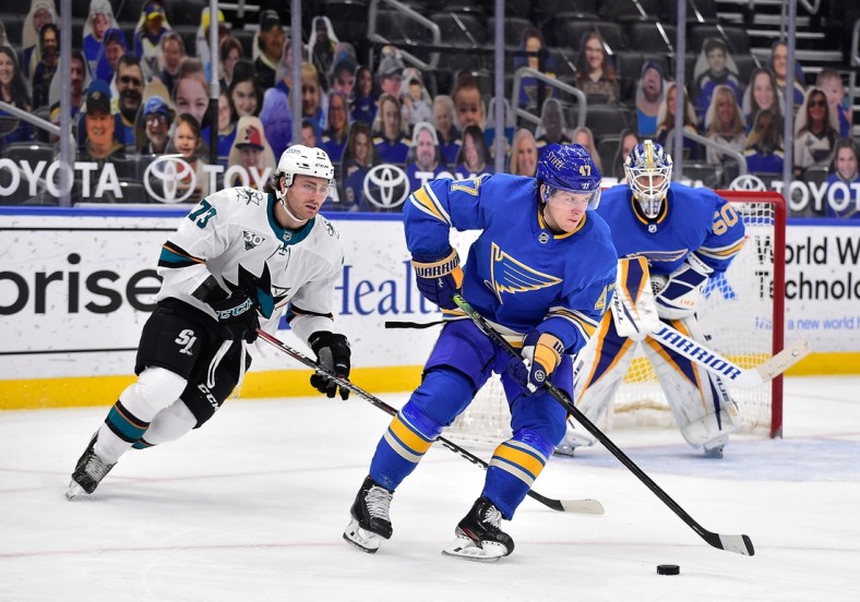 Feb 20, 2021; St. Louis, Missouri, USA;  St. Louis Blues defenseman Torey Krug (47) handles the puck during the second period against the San Jose Sharks at Enterprise Center. Mandatory Credit: Jeff Curry-USA TODAY Sports