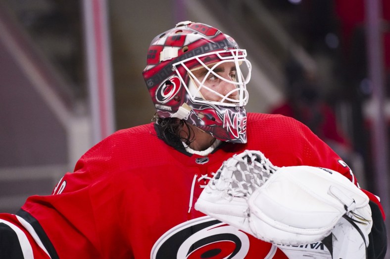 Feb 20, 2021; Raleigh, North Carolina, USA;  Carolina Hurricanes goaltender Alex Nedeljkovic (39) looks on against the Tampa Bay Lightning during the third period at PNC Arena. Mandatory Credit: James Guillory-USA TODAY Sports
