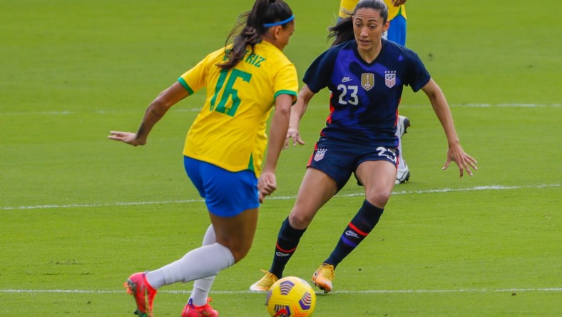 Feb 21, 2021; Orlando, Florida, USA; United States forward Christen Press (23) and Brazil Beatriz forward (16) battle for the ball during the first half of the She Believes Cup soccer match at Exploria Stadium. Mandatory Credit: Mike Watters-USA TODAY Sports