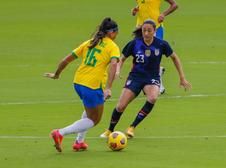 Feb 21, 2021; Orlando, Florida, USA; United States forward Christen Press (23) and Brazil Beatriz forward (16) battle for the ball during the first half of the She Believes Cup soccer match at Exploria Stadium. Mandatory Credit: Mike Watters-USA TODAY Sports