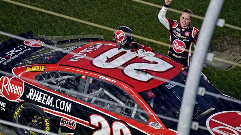 Feb 21, 2021; Daytona Beach, Florida, USA; NASCAR Cup Series driver Christopher Bell (20) celebrates winning the O'Reilly Auto Parts 253 at Daytona International Speedway. Mandatory Credit: Jasen Vinlove-USA TODAY Sports