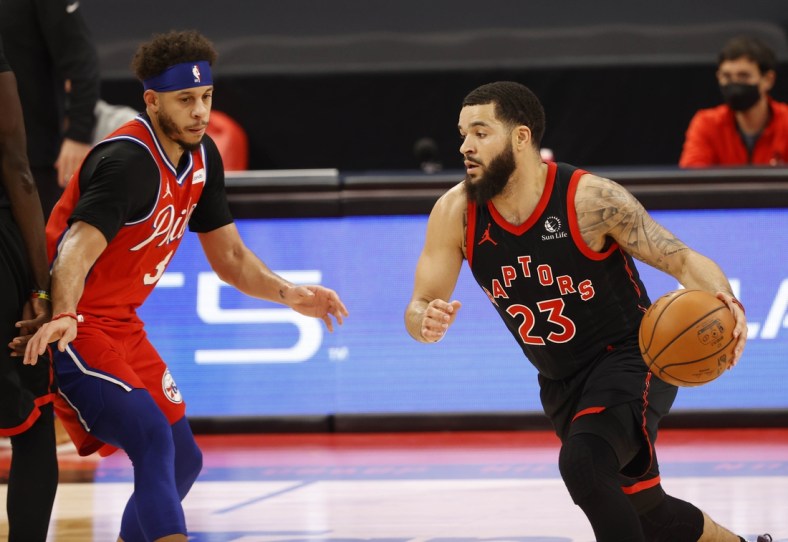 Feb 21, 2021; Tampa, Florida, USA; Toronto Raptors guard Fred VanVleet (23) drives to the basket as Philadelphia 76ers guard Seth Curry (31) attempts to defend during the first quarter at Amalie Arena. Mandatory Credit: Kim Klement-USA TODAY Sports