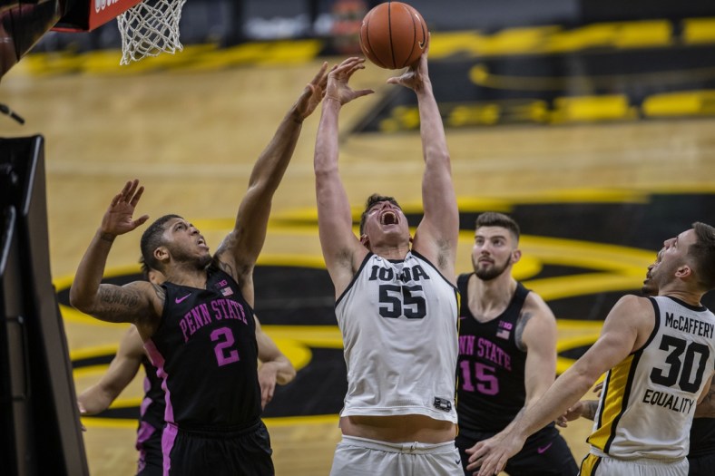 Sunday, Feb. 21, 2021; Iowa City, Iowa, USA; Iowa center Luka Garza (55) catches a rebound during the second half of a men's basketball game against Penn State on Sunday, Feb. 21, 2021 at Carver Hawkeye Arena. The Hawkeyes defeated the Nittany Lions, 74-68. Garza broke the record for Iowa's all-time leading scorer and now has a career total of 2,126 points. Mandatory Credit: Hannah Kinson/Daily Iowan via USA TODAY Network
