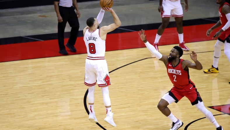 Feb 22, 2021; Houston, Texas, USA; Zach LaVine #8 of the Chicago Bulls shoots a basket ahead of David Nwaba #2 of the Houston Rockets during the second quarter at Toyota Center. Mandatory Credit: Carmen Mandato/Pool Photo-USA TODAY Sports