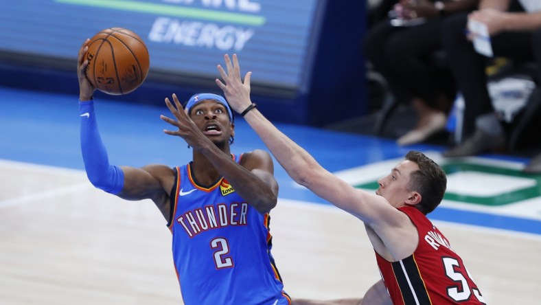 Feb 22, 2021; Oklahoma City, Oklahoma, USA; Oklahoma City Thunder guard Shai Gilgeous-Alexander (2) goes up for a shot as Miami Heat guard Duncan Robinson (55) defends during the first quarter at Chesapeake Energy Arena. Mandatory Credit: Alonzo Adams-USA TODAY Sports