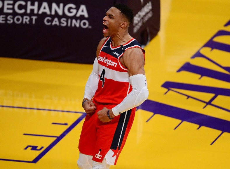 Feb 22, 2021; Los Angeles, California, USA; Washington Wizards guard Russell Westbrook (4) reacts after scoring a basket and drawing a foul against the Los Angeles Lakers during overtime at Staples Center. Mandatory Credit: Gary A. Vasquez-USA TODAY Sports