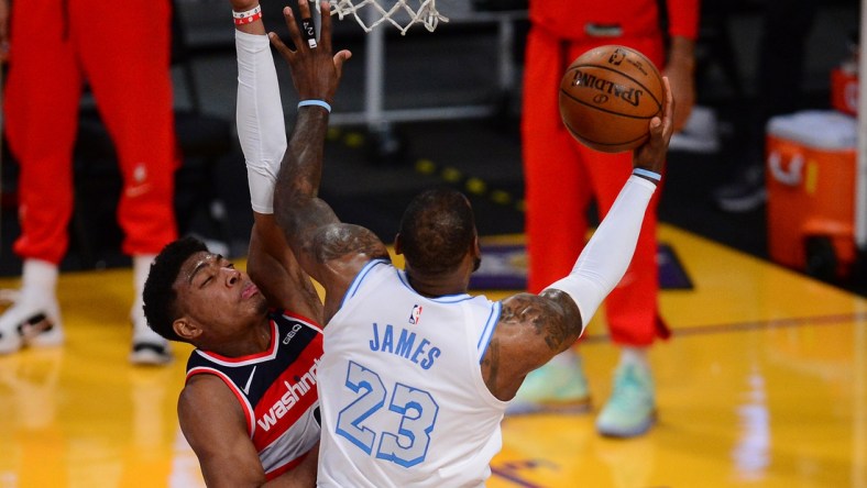 Feb 22, 2021; Los Angeles, California, USA; Los Angeles Lakers forward LeBron James (23) moves to the basket against Washington Wizards forward Rui Hachimura (8) during overtime at Staples Center. Mandatory Credit: Gary A. Vasquez-USA TODAY Sports