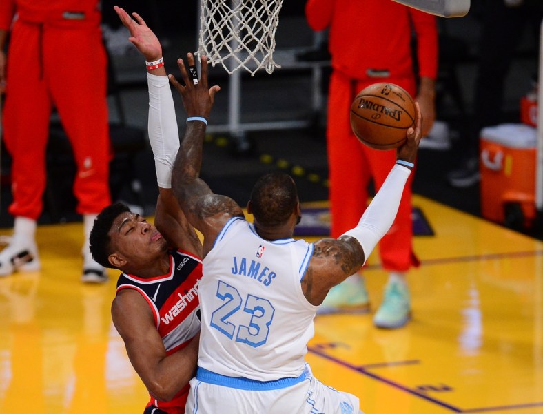 Feb 22, 2021; Los Angeles, California, USA; Los Angeles Lakers forward LeBron James (23) moves to the basket against Washington Wizards forward Rui Hachimura (8) during overtime at Staples Center. Mandatory Credit: Gary A. Vasquez-USA TODAY Sports