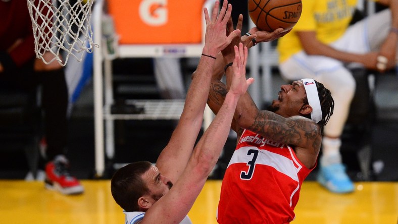 Feb 22, 2021; Los Angeles, California, USA; Washington Wizards guard Bradley Beal (3) shoots against Los Angeles Lakers center Marc Gasol (14) during the second half at Staples Center. Mandatory Credit: Gary A. Vasquez-USA TODAY Sports