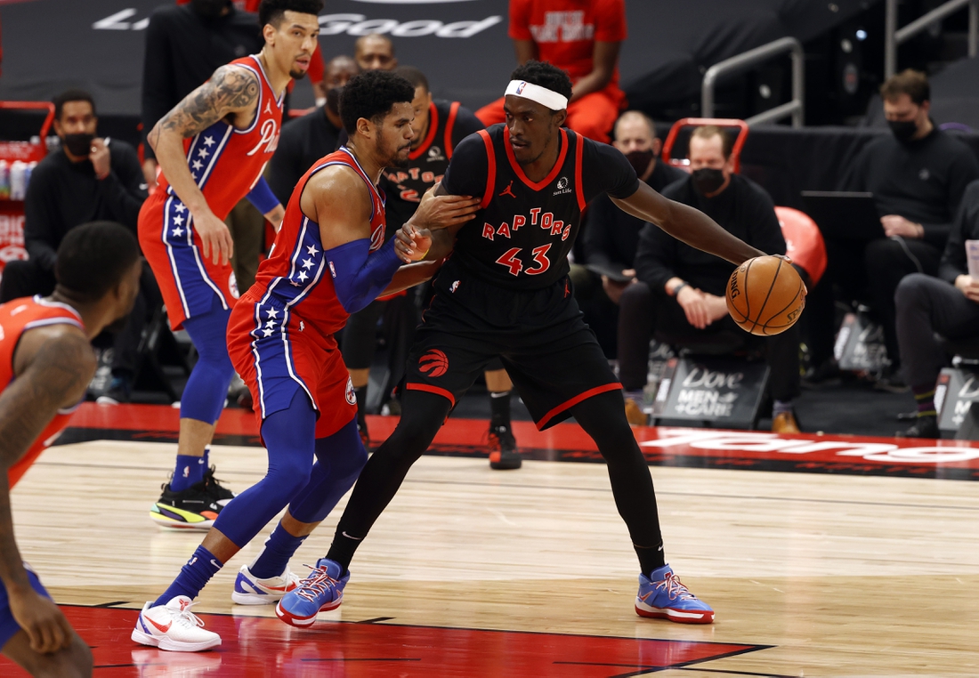 Feb 23, 2021; Tampa, Florida, USA; Toronto Raptors forward Pascal Siakam (43) drives to the basket as Philadelphia 76ers forward Tobias Harris (12) defends during the first half at Amalie Arena. Mandatory Credit: Kim Klement-USA TODAY Sports