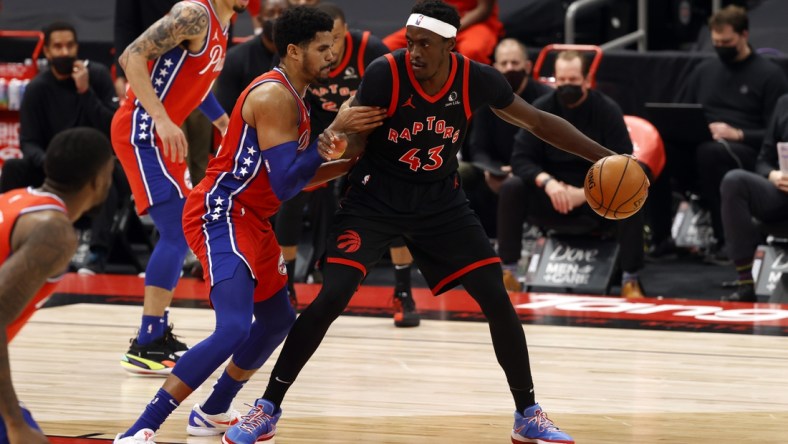 Feb 23, 2021; Tampa, Florida, USA; Toronto Raptors forward Pascal Siakam (43) drives to the basket as Philadelphia 76ers forward Tobias Harris (12) defends during the first half at Amalie Arena. Mandatory Credit: Kim Klement-USA TODAY Sports