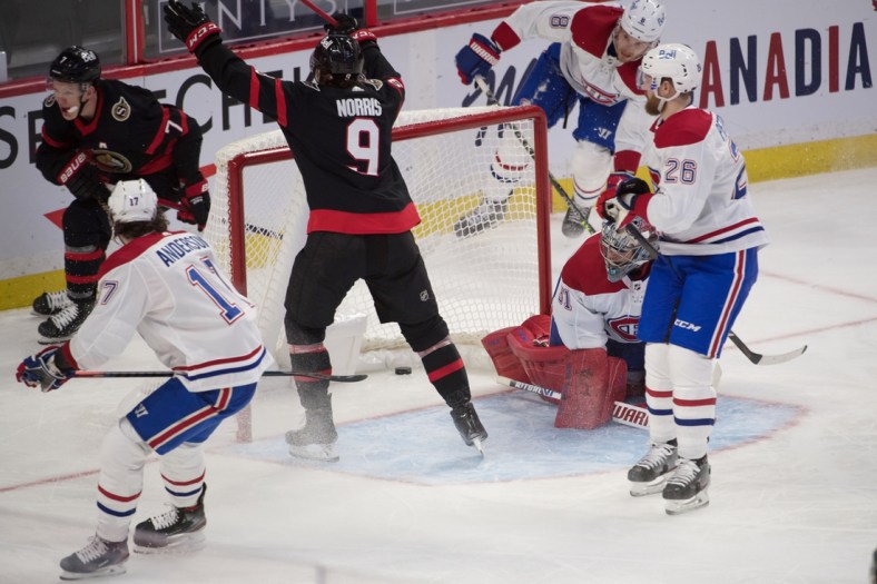 Feb 23, 2021; Ottawa, Ontario, CAN; Ottawa Senators left wing Brady Tkatchuk (7) scores against Montreal Canadiens goalie Carey Price (31) in the third period at the Canadian Tire Centre. Mandatory Credit: Marc DesRosiers-USA TODAY Sports