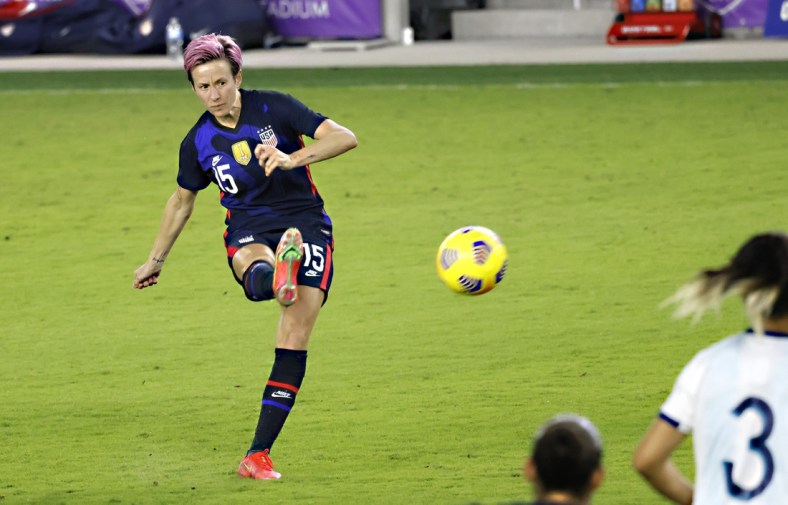 Feb 24, 2021; Orlando, Florida, USA; United States forward Megan Rapinoe (15) kicks the ball during the second half of a She Believes Cup soccer match against Argentina at Exploria Stadium. Mandatory Credit: Reinhold Matay-USA TODAY Sports