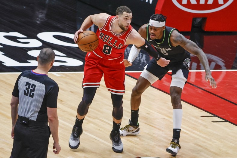 Feb 24, 2021; Chicago, Illinois, USA; Chicago Bulls guard Zach LaVine (8) is defended by Minnesota Timberwolves forward Jarred Vanderbilt (8) during the second half of an NBA game at United Center. Mandatory Credit: Kamil Krzaczynski-USA TODAY Sports