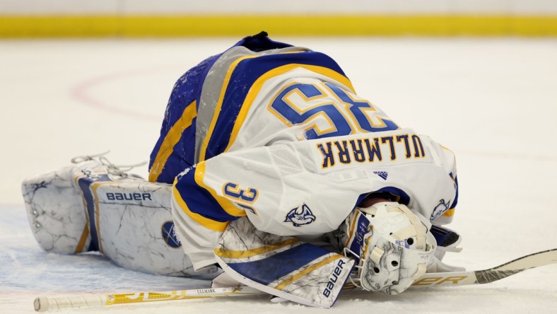 Feb 25, 2021; Buffalo, New York, USA; Buffalo Sabres goaltender Linus Ullmark (35) gets hurt during the first period against the New Jersey Devils at KeyBank Center. Mandatory Credit: Timothy T. Ludwig-USA TODAY Sports