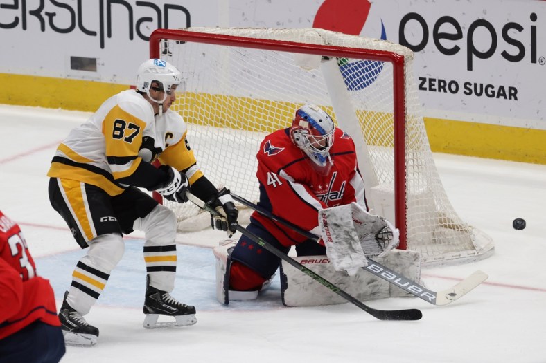 Feb 25, 2021; Washington, District of Columbia, USA; Washington Capitals goaltender Vitek Vanecek (41) m makes a save on Pittsburgh Penguins center Sidney Crosby (87) in the first period at Capital One Arena. Mandatory Credit: Geoff Burke-USA TODAY Sports