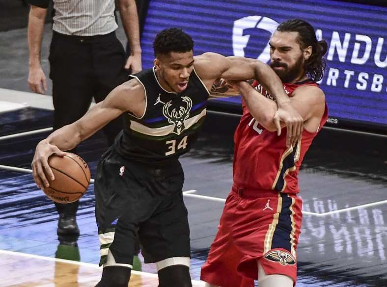 Feb 25, 2021; Milwaukee, Wisconsin, USA; Milwaukee Bucks forward Giannis Antetokounmpo (34) drives for the basket against New Orleans Pelicans center Steven Adams (12) in the first quarter at Fiserv Forum. Mandatory Credit: Benny Sieu-USA TODAY Sports
