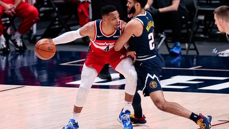 Feb 25, 2021; Denver, Colorado, USA; Washington Wizards guard Russell Westbrook (4) controls the ball as Denver Nuggets guard Jamal Murray (27) guards in the second quarter at Ball Arena. Mandatory Credit: Isaiah J. Downing-USA TODAY Sports