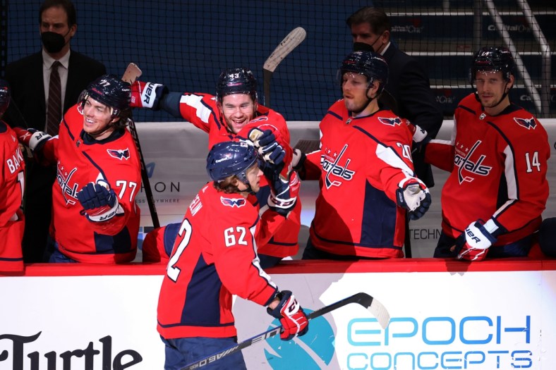 Feb 25, 2021; Washington, District of Columbia, USA; Washington Capitals left wing Carl Hagelin (62) celebrates with teammates after scoring an empty net goal against the Pittsburgh Penguins in the third period at Capital One Arena. Mandatory Credit: Geoff Burke-USA TODAY Sports