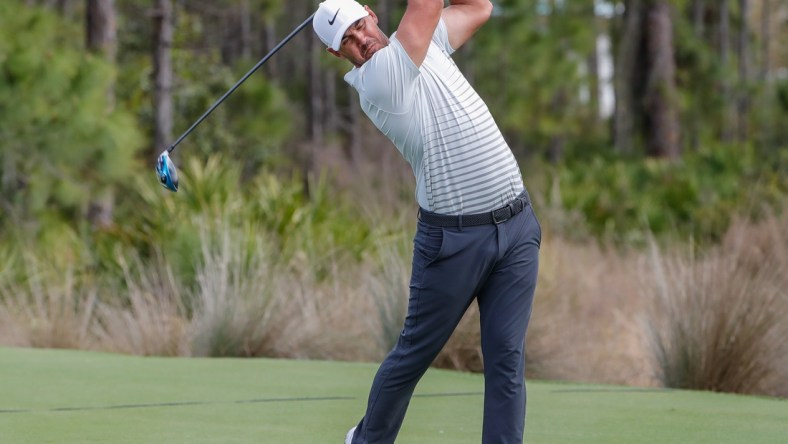 Feb 26, 2021; Bradenton, Florida, USA; Brooks Koepka plays his shot from the third tee during the second round of World Golf Championships at The Concession golf tournament at The Concession Golf Club. Mandatory Credit: Mike Watters-USA TODAY Sports