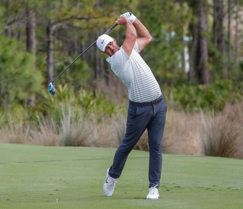 Feb 26, 2021; Bradenton, Florida, USA; Brooks Koepka plays his shot from the third tee during the second round of World Golf Championships at The Concession golf tournament at The Concession Golf Club. Mandatory Credit: Mike Watters-USA TODAY Sports