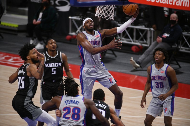 Feb 26, 2021; Detroit, Michigan, USA; Detroit Pistons forward Jerami Grant (9) goes to the basket during the first quarter against the Sacramento Kings at Little Caesars Arena. Mandatory Credit: Tim Fuller-USA TODAY Sports