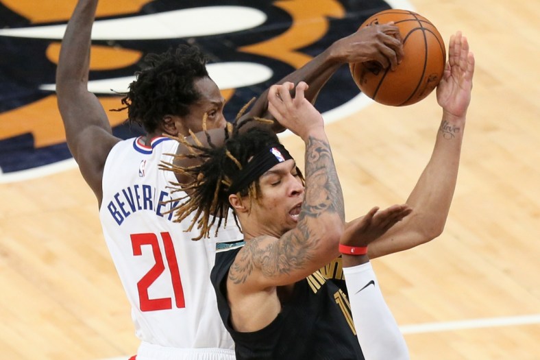 Feb 26, 2021; Memphis, Tennessee, USA; Memphis Grizzlies forward Brandon Clarke (15) has the ball knocked away by Los Angeles Clippers guard Patrick Beverley (21) in the second quarter at FedExForum. Mandatory Credit: Nelson Chenault-USA TODAY Sports