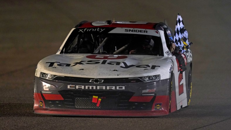 Feb 27, 2021; Miami, FL, USA; NASCAR Xfinity Series driver Myatt Snider (2) does a victory lap after winning the Contender Boats 250 at Homestead-Miami Speedway. Mandatory Credit: Jasen Vinlove-USA TODAY Sports