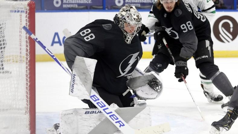 Feb 27, 2021; Tampa, Florida, USA; Tampa Bay Lightning goaltender Andrei Vasilevskiy (88) makes a save against the Dallas Stars during the second period at Amalie Arena. Mandatory Credit: Kim Klement-USA TODAY Sports