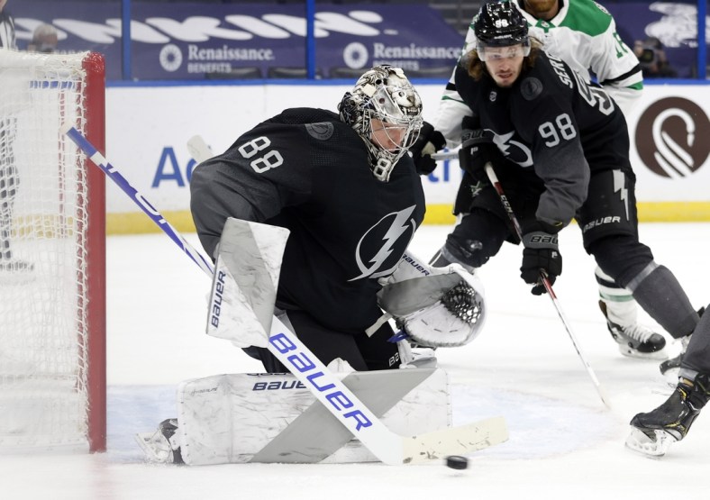 Feb 27, 2021; Tampa, Florida, USA; Tampa Bay Lightning goaltender Andrei Vasilevskiy (88) makes a save against the Dallas Stars during the second period at Amalie Arena. Mandatory Credit: Kim Klement-USA TODAY Sports