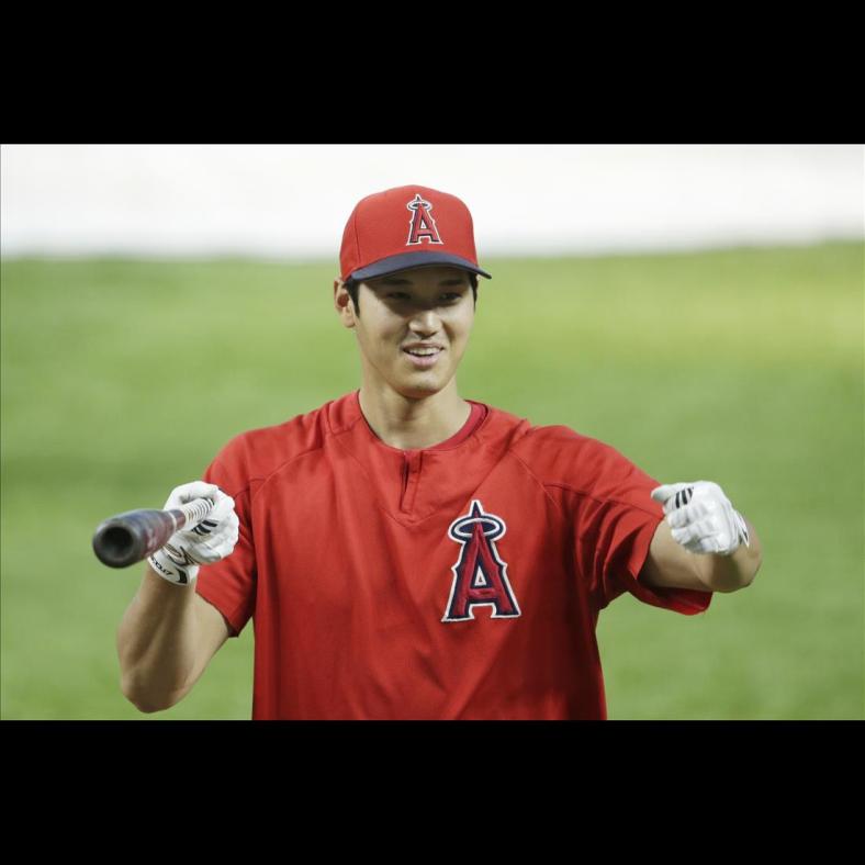 Aug 7, 2020; Arlington, Texas, USA; Los Angeles Angels designated hitter Shohei Ohtani (17) reacts on the field before a game against the Texas Rangers at Globe Life Field. Mandatory Credit: Tim Heitman-USA TODAY Sports