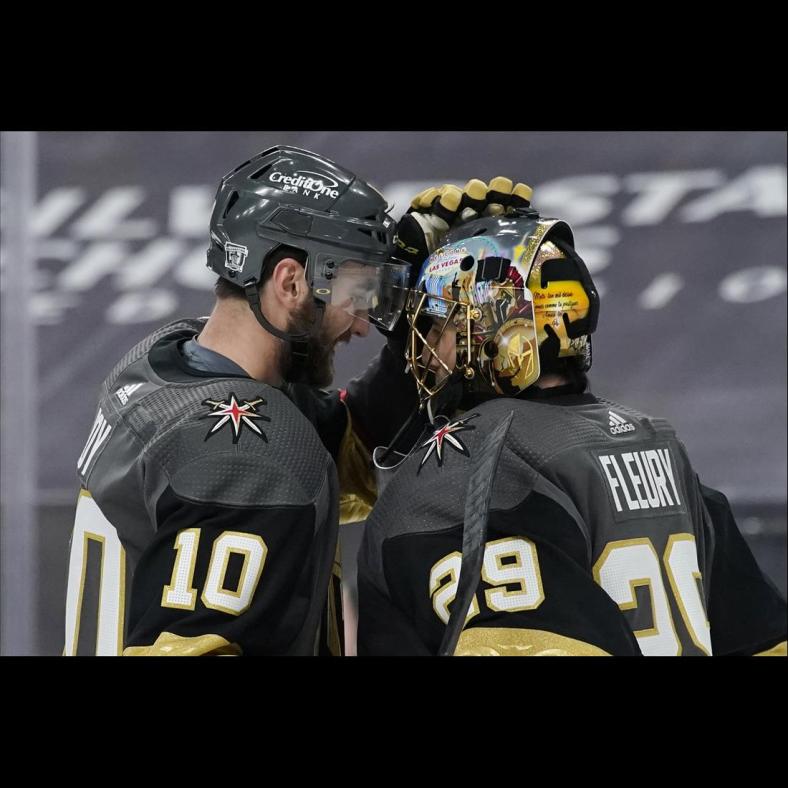 Feb 5, 2021; Las Vegas, Nevada, USA; Vegas Golden Knights center Nicolas Roy (10) and goaltender Marc-Andre Fleury (29) celebrate after defeating the Los Angeles Kings in an NHL hockey game Friday, Feb. 5, 2021, in Las Vegas at T-Mobile Arena. Mandatory Credit: John Locher/POOL PHOTOS-USA TODAY Sports