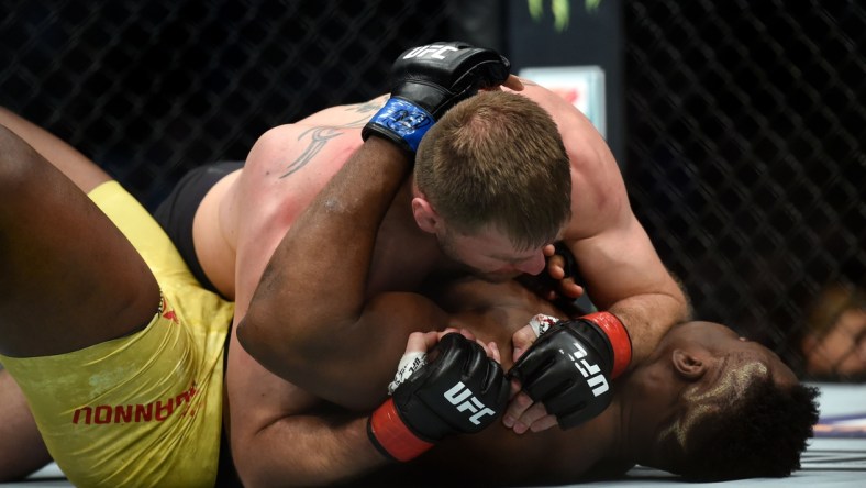 Jan 20, 2018; Boston, MA, USA; Stipe Miocic (red gloves) fights Francis Ngannou (blue gloves) during UFC 220 at the TD Garden. Mandatory Credit: Bob DeChiara-USA TODAY Sports