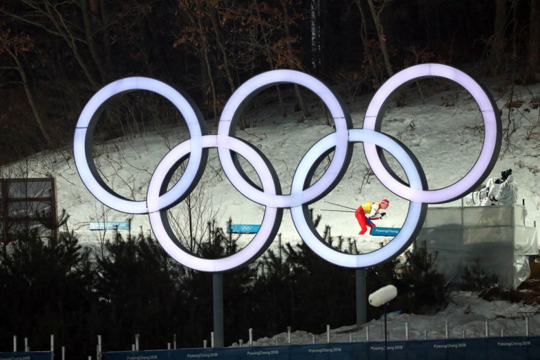 Feb 22, 2018; Pyeongchang, South Korea; Lukas Danek (CZE) skis past the Olympic rings in the nordic combined mens team large hill and 4x5km ski jumping event during the Pyeongchang 2018 Olympic Winter Games at Alpensia Ski Jumping Centre. Mandatory Credit: Rob Schumacher-USA TODAY Sports