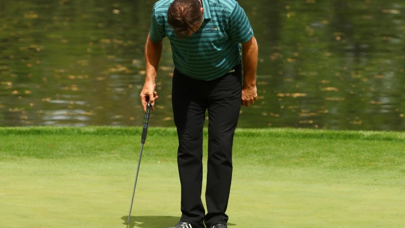 Apr 4, 2018; Augusta, GA, USA; Nick Faldo takes a bow on the 9th green during the Par 3 Contest before the Masters golf tournament at Augusta National Golf Club. Mandatory Credit: Rob Schumacher-USA TODAY Sports