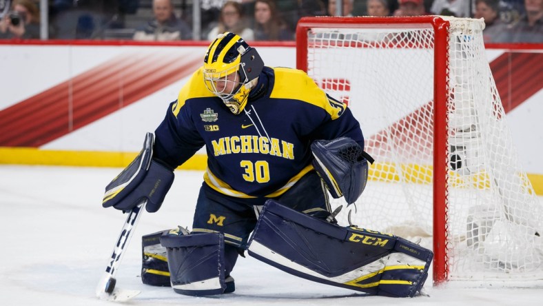 Apr 5, 2018; St. Paul, MN, USA; Michigan Wolverines goaltender Hayden Lavigne (30) makes a save in the second period against Notre Dame Fighting Irish in the 2018 Frozen Four college hockey national semifinals at Xcel Energy Center. Mandatory Credit: Brad Rempel-USA TODAY Sports